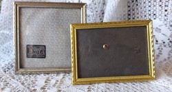 A pair of smaller desktop metal photo frames