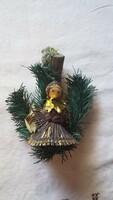 Old angelic Christmas ornament made of artificial and natural material