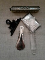 An old metal tinned shoe spoon, a paper clip and a decorative clothes brush in usable condition