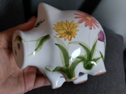Glazed ceramic piggy bank with flower pattern