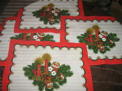 Beautiful red Christmas napkin with candles, pine branches, placemat, placemat
