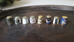 8 thimbles covered with fire enamel and mother-of-pearl.