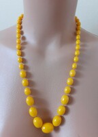 Older plastic necklace with decreasing links (not vinyl)