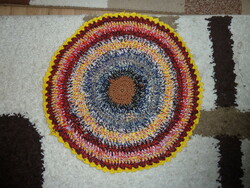 Colored crocheted round rug with a diameter of 60 cm
