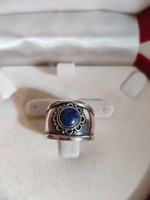 Wide silver ring with a lapis lazuli stone