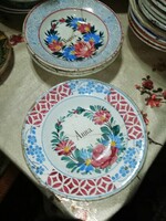 From a collection of antique wall plates, there is a crack in the lining of the plate 52