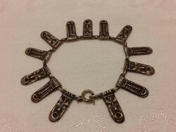 An interesting bracelet made of silver colored 