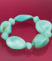 Bracelet made of turquoise colored acrylic beads with small wooden beads