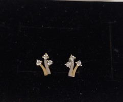 Very decorative 14 carat gold earring decorated with white gold and 3 small zircon stones.!I