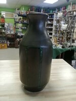 Black ceramic vase with green pattern