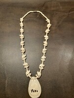 Bone necklace with elephant pendant and chain links. In very nice condition
