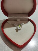 Silver ring with stones in the shape of a green drop