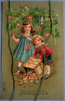 Antique embossed Christmas greeting card - little girl, little boy decorating a Christmas tree from 1912