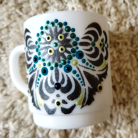 White mug with mandala pattern