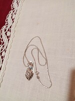 Old marked silver pendant on a silver chain