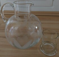A large glass jug with a polished, beautiful pattern.