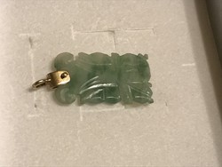 Jade pendant with gold fittings