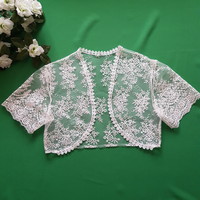 New, custom-made approx. L ecru colored, short-sleeved, embroidered lace bolero