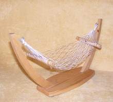 Wooden rocking bed for a toy doll