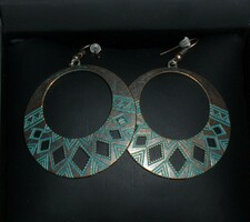 Earrings in boho style, openwork pattern.