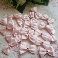 New, handmade pink satin bow ornament, decoration