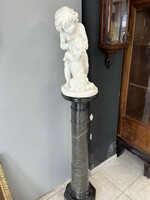 Carved marble statue with marble postman.