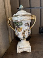 Italian goblet vase with a base, a lid, a handle, and a convex pattern.