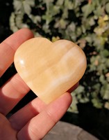 Orange calcite heart, mineral crystal