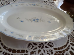 Jena bowl made of oval milk glass with a blue flower pattern. Facepalm