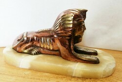 Sphinx, mixed technique of bronze and red copper, on a green onyx pedestal