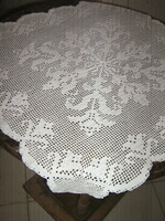 Beautiful special snow-white hand-crocheted antique lace tablecloth with flower pattern