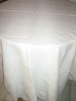 A filigree woven tablecloth with a beautiful madeira lace edge material