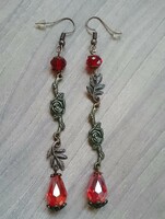 Rose bronze earrings with a red drop