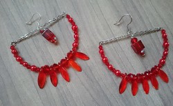 Red curved earrings on a chain