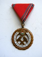 Miner's service medal on a triangular silk ribbon