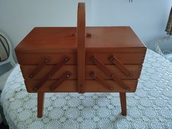 Wooden sewing box on legs in good condition