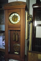 Art Nouveau, chiseled, two-weight wall clock.