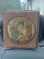 Antique icon, painted on wood, with a copper frame, the diameter of the copper frame is approx. 10 cm