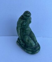 Ceramic sculpture of a seated woman