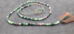 Zoisite ruby pearl row 23 carats. With certification.