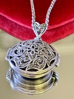 A stunning silver necklace watch