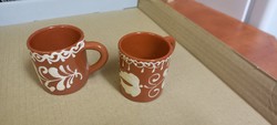 2 ceramic coffee cups with a folk pattern