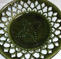 Openwork decorative plate with a green glaze with a special openwork pattern