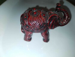 Elephant statue made of red resin.