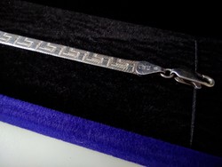 Silver bracelet marked with a meander pattern