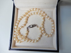Old string of real pearls with a silver clasp
