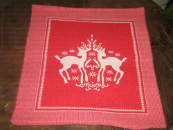 Beautiful decorative pillow with a woven deer pattern