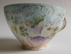 Antique tea cup with ball rose pattern - a nick on the rim