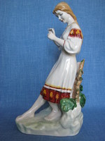 Polonne porcelain girl looking at flowers large size 30 cm