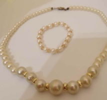 $ String of pearls with rubber bracelet + gift pearl clip